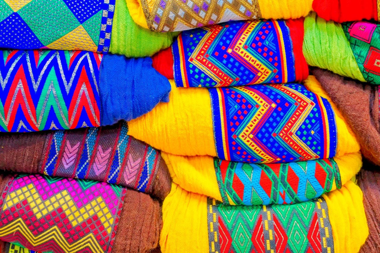 Colorful handwoven textiles with intricate patterns displaying cultural heritage and craftsmanship.